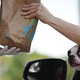 Dog peeking out of driver's side window in drive-thru